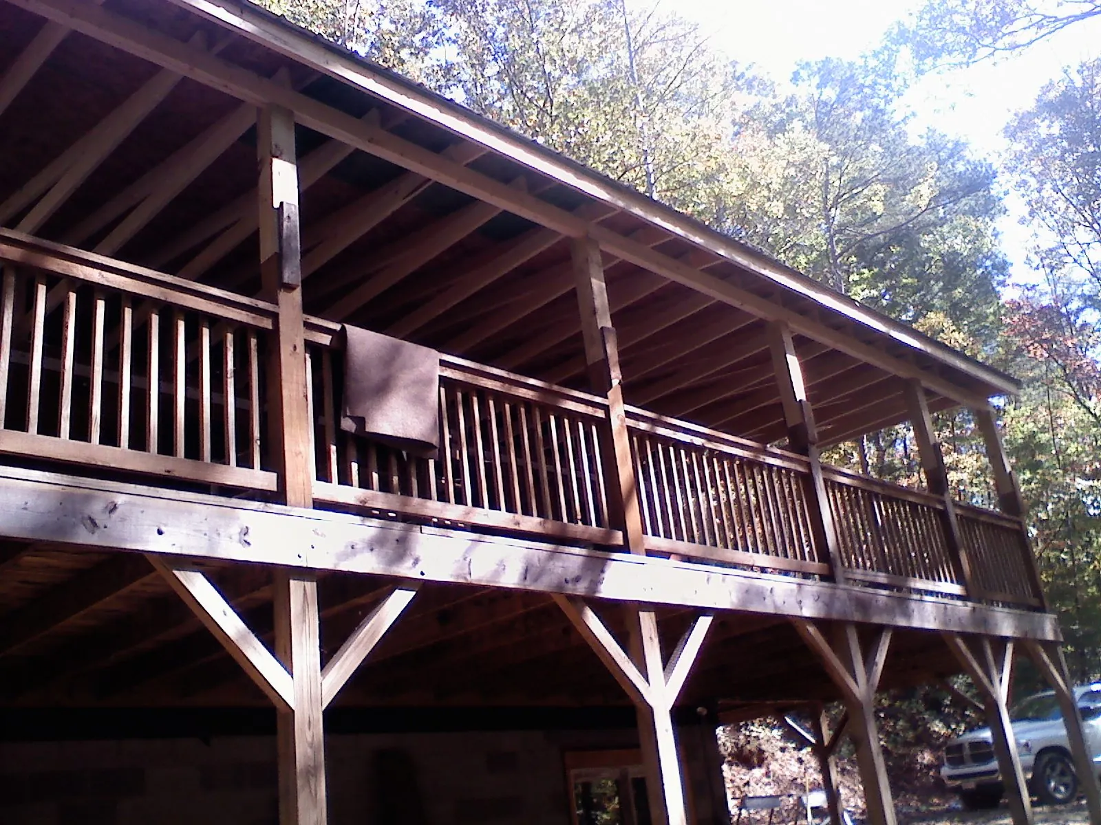 Timber framing under a new elevated porch and deck — Roof Leak Repair in Center Harbor by Roofing Brothers